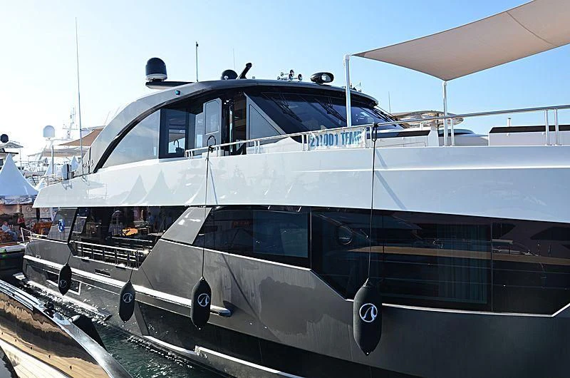 a white yacht on a dock aboard SEASUITE Yacht for Charter