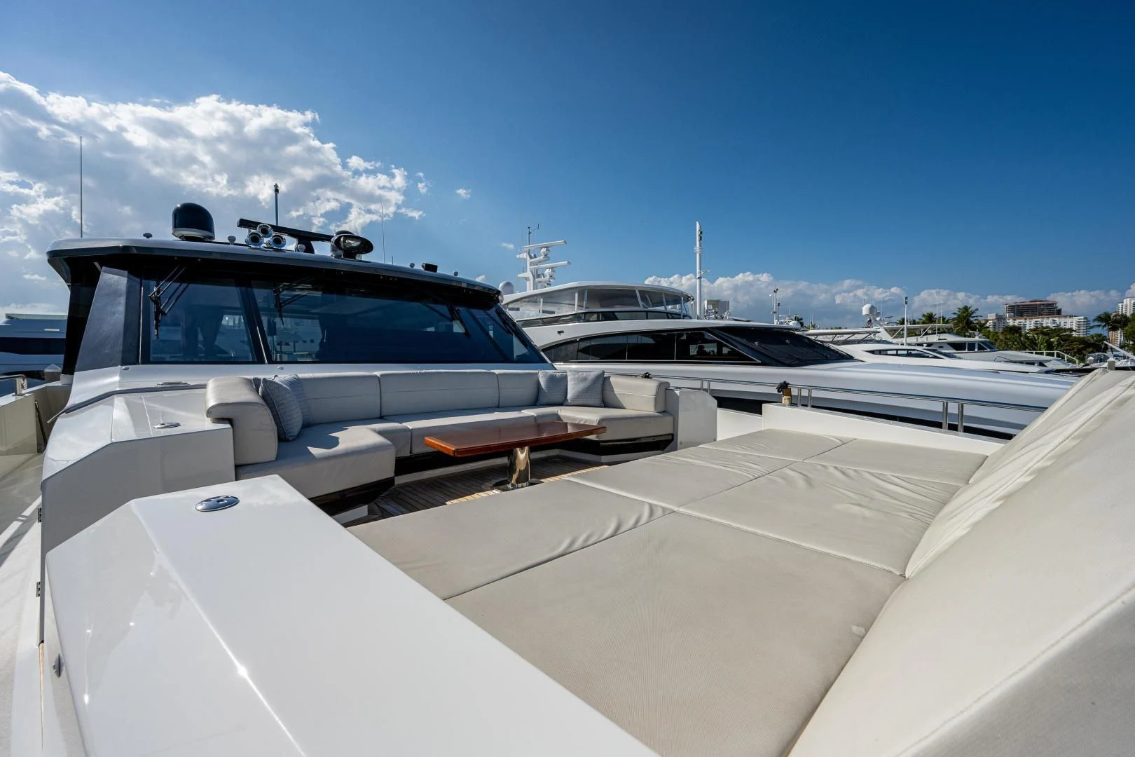 a white car parked on a dock aboard SEASUITE Yacht for Charter