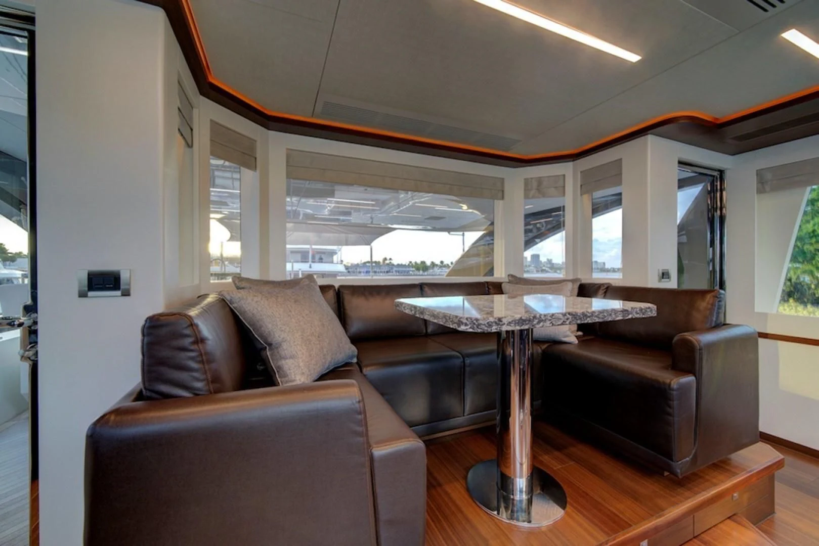 a living room with a couch and a table aboard SEASUITE Yacht for Charter