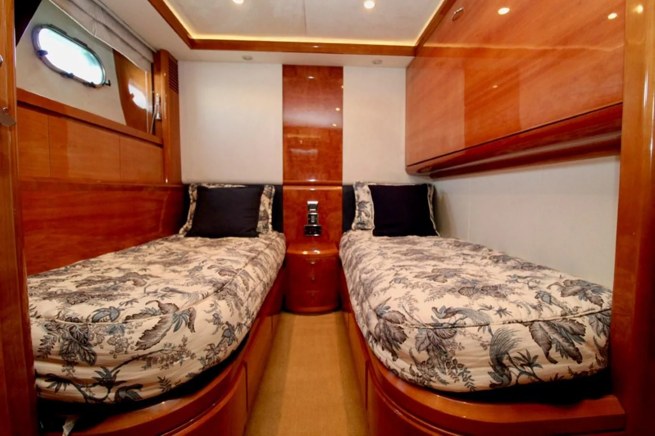 a room with two beds aboard AVICCI Yacht for Sale