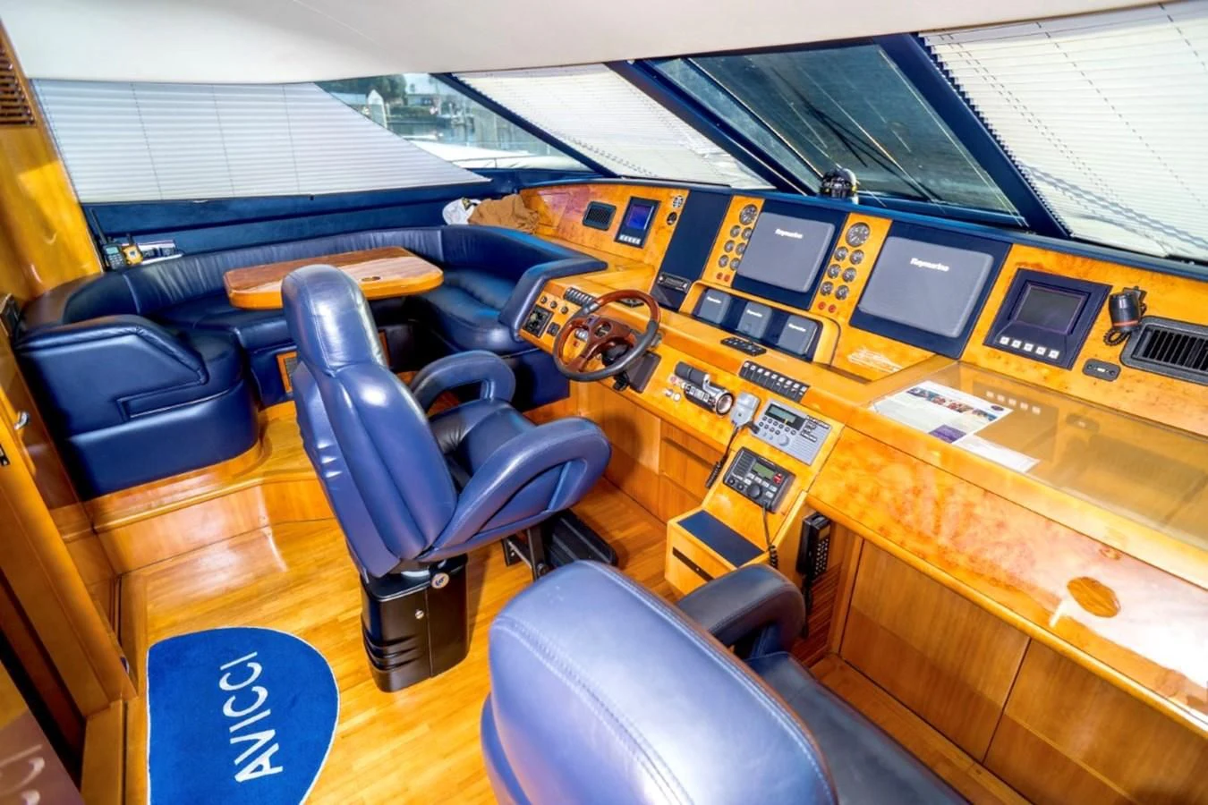 a room with many computers and chairs aboard AVICCI Yacht for Sale