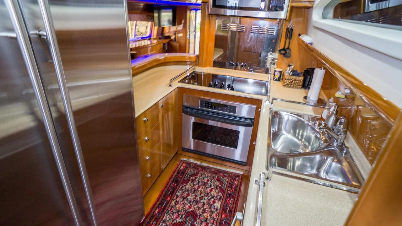 a kitchen with a sink and stove aboard AVICCI Yacht for Sale