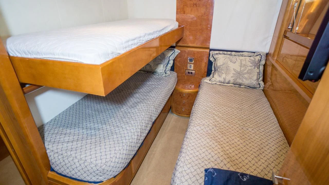 a couple of beds in a room aboard AVICCI Yacht for Sale