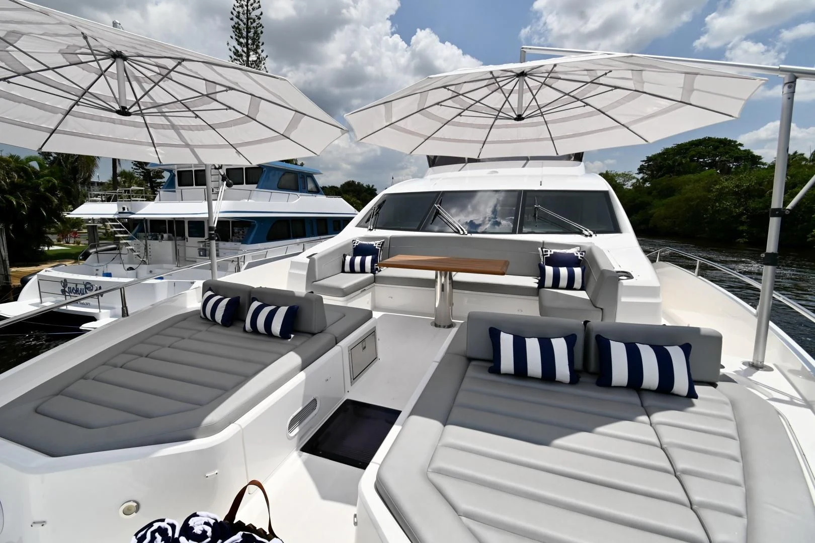 a white car parked next to a white car aboard CAESURA Yacht for Sale