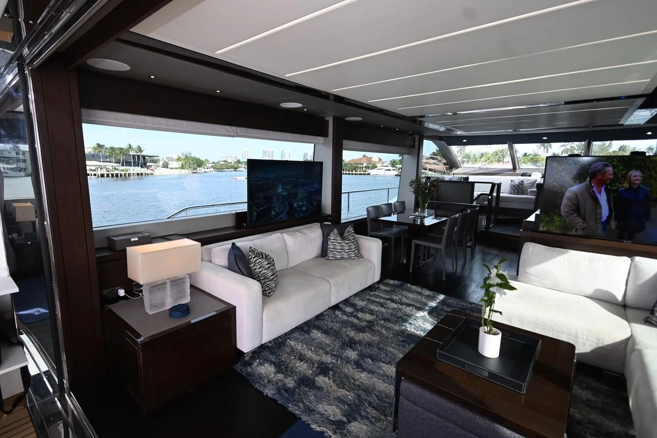 a living room with a large window aboard CAESURA Yacht for Sale