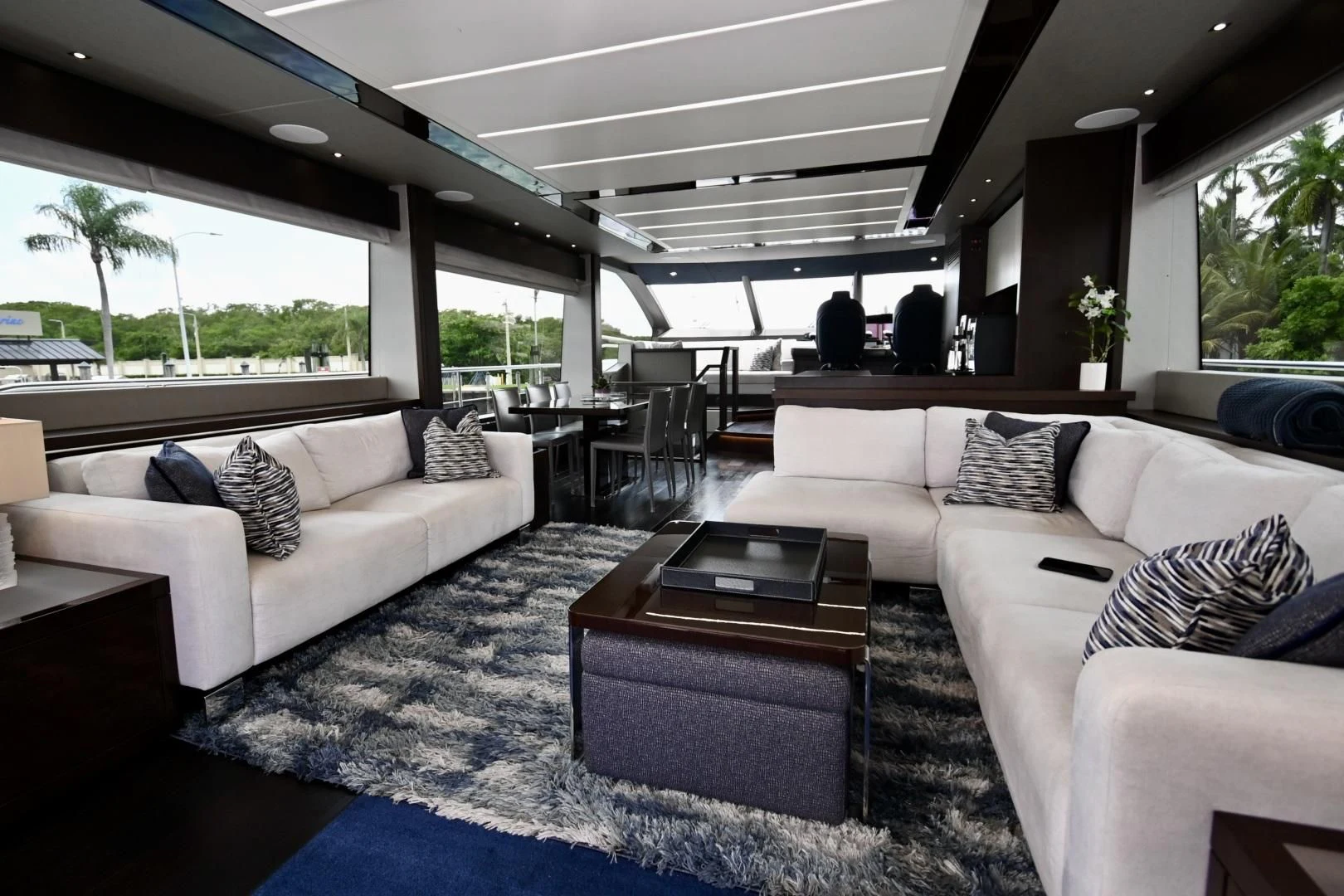 a living room with a couch and a coffee table aboard CAESURA Yacht for Sale