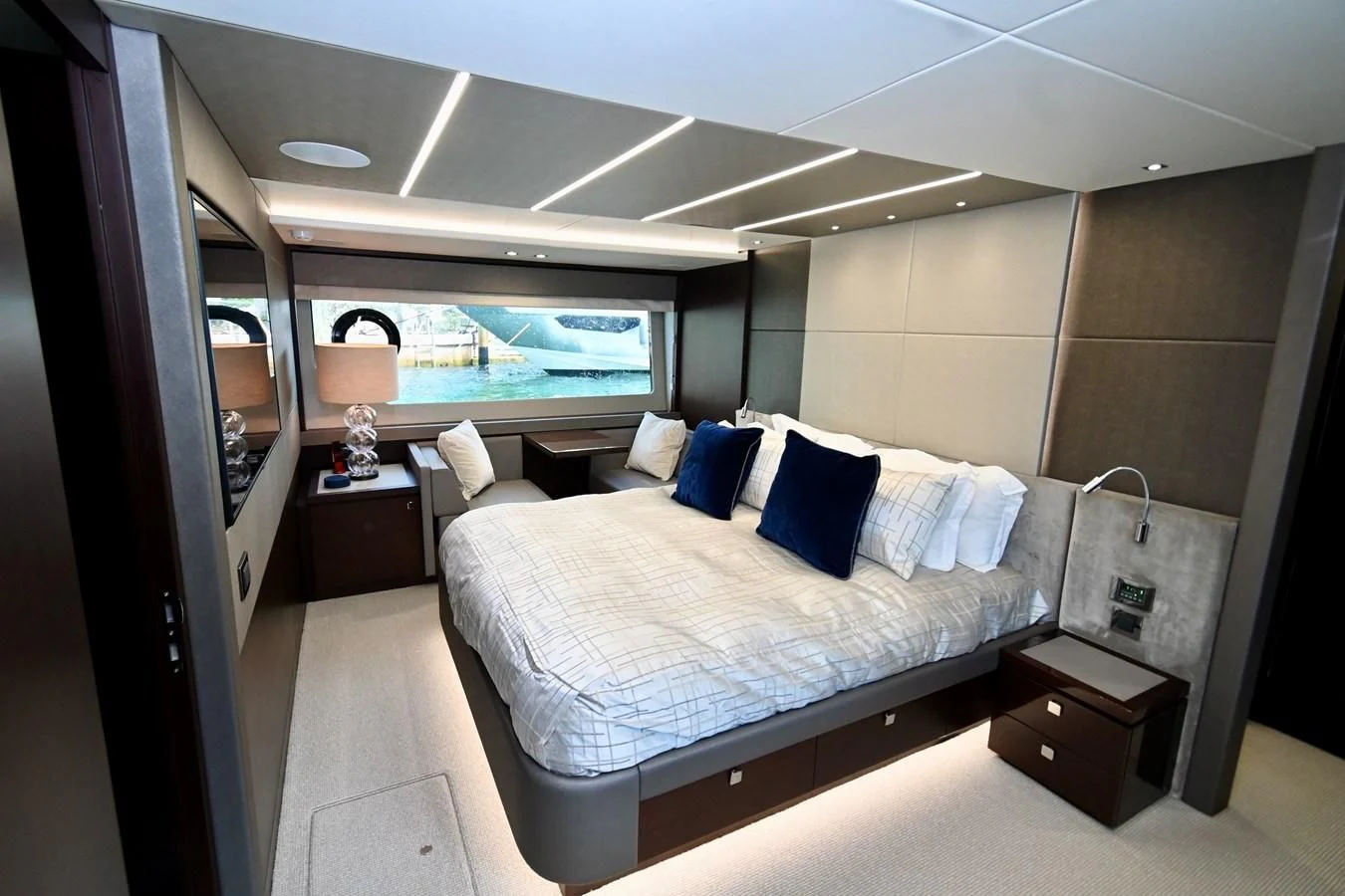 a room with a bed and a window aboard CAESURA Yacht for Sale