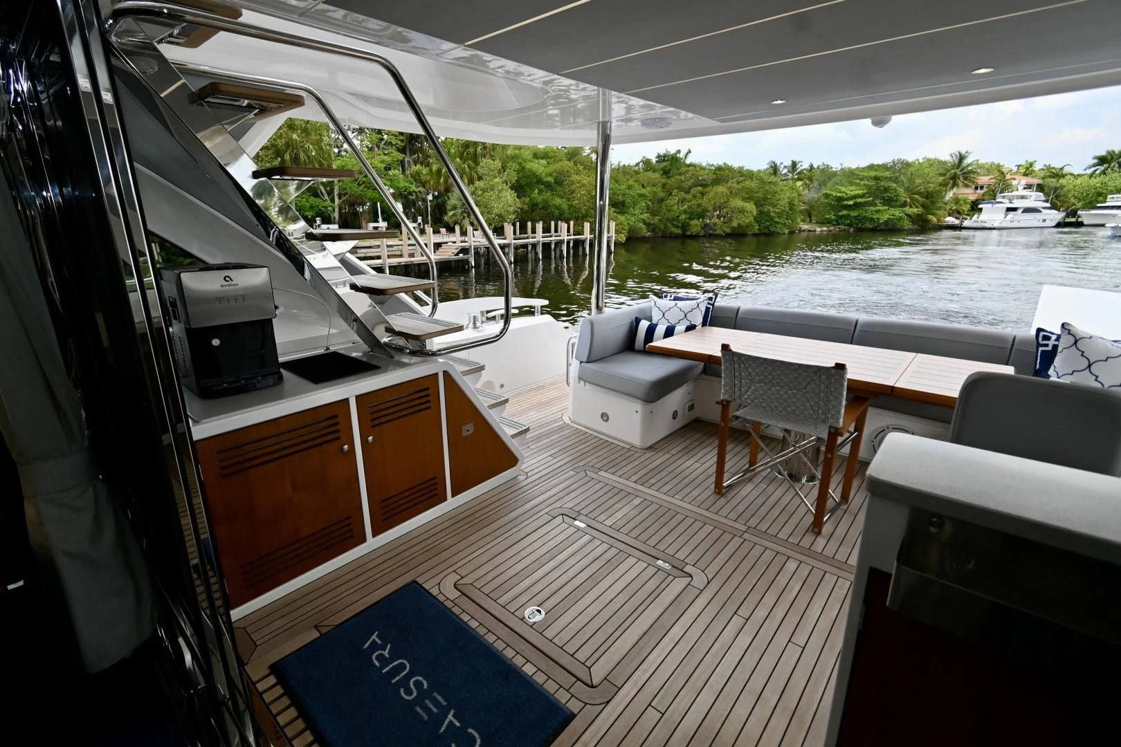 a boat with a deck and chairs aboard CAESURA Yacht for Sale