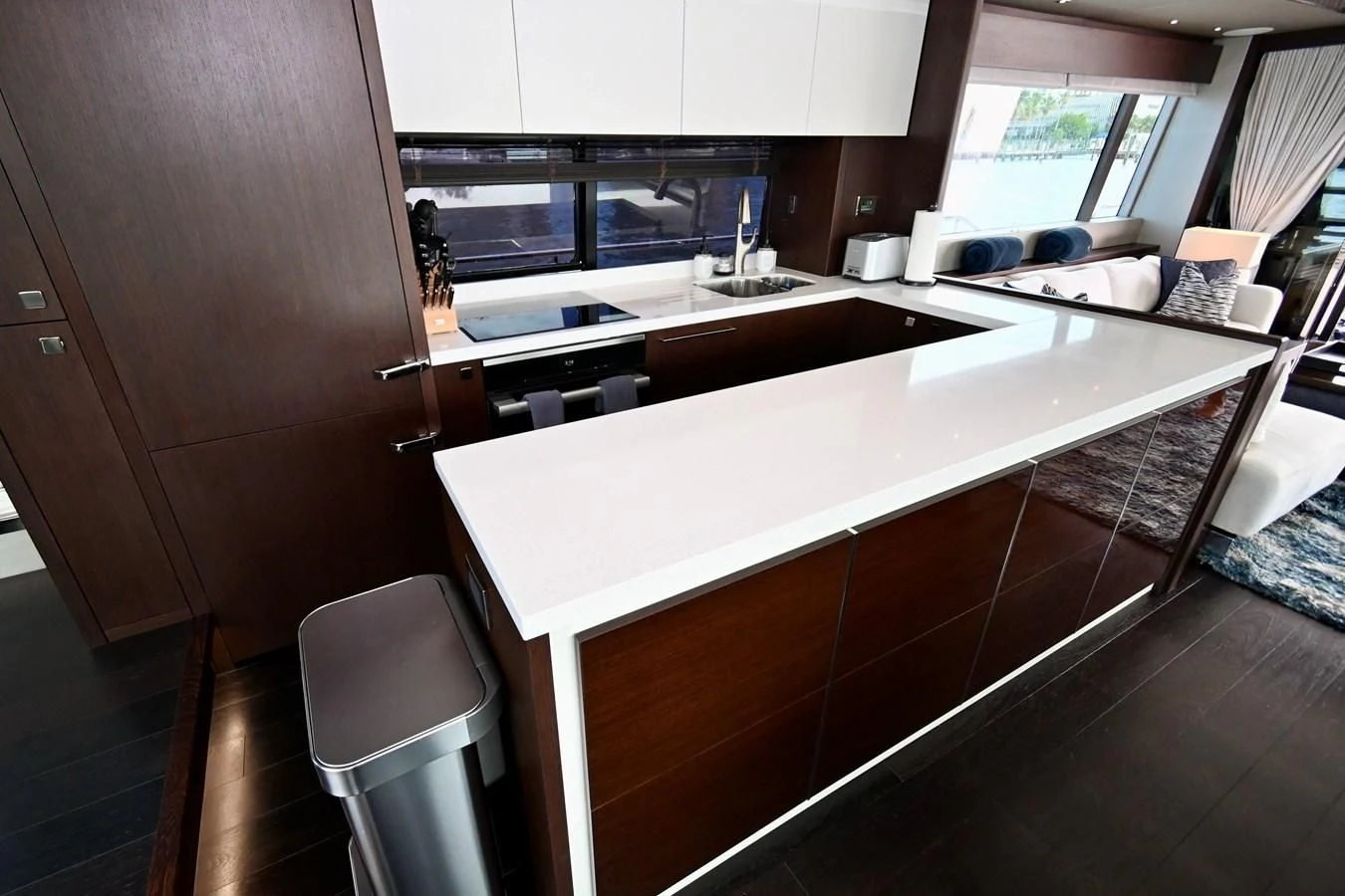 a kitchen with white cabinets aboard CAESURA Yacht for Sale