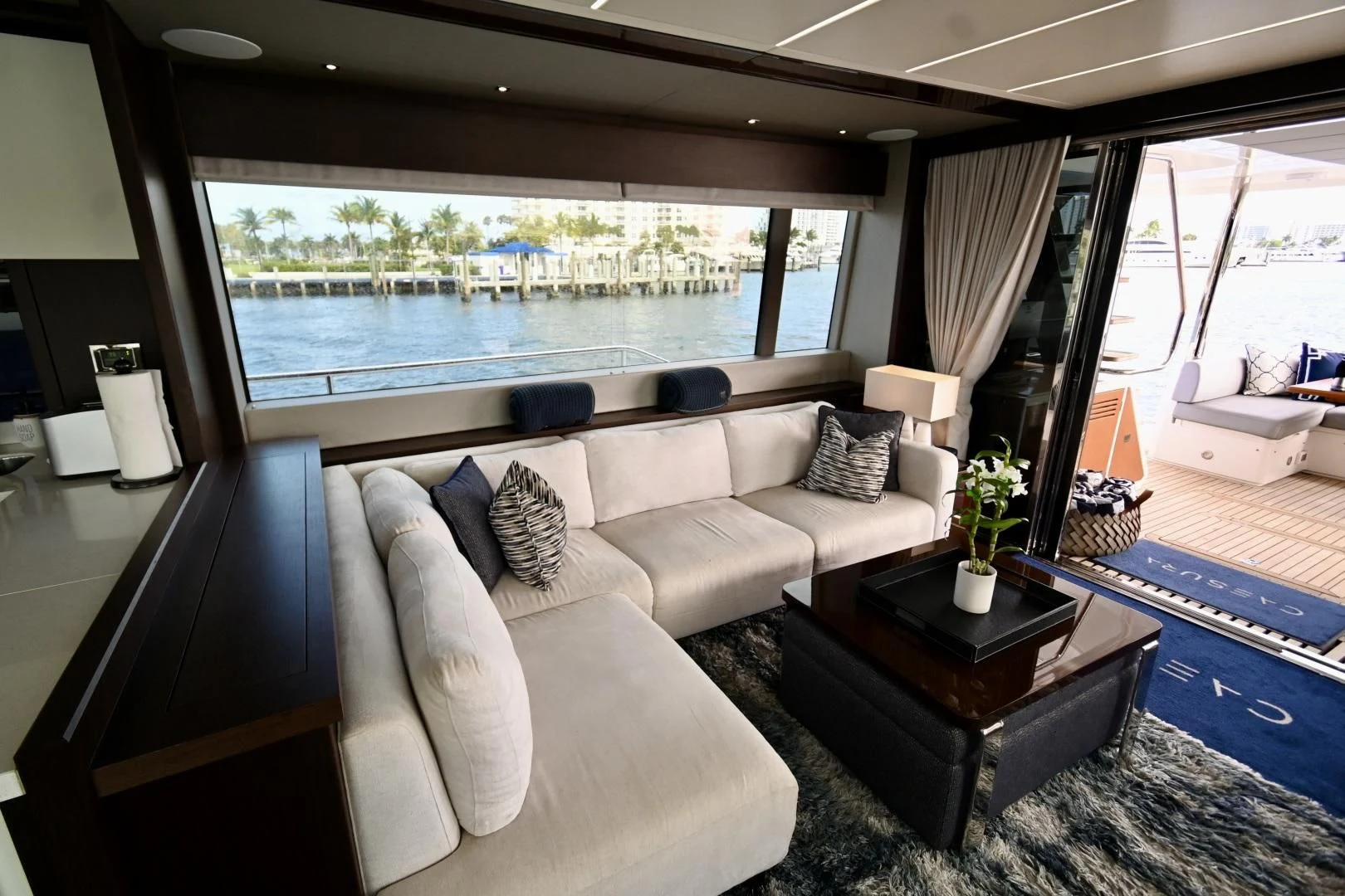 a living room with a large window aboard CAESURA Yacht for Sale