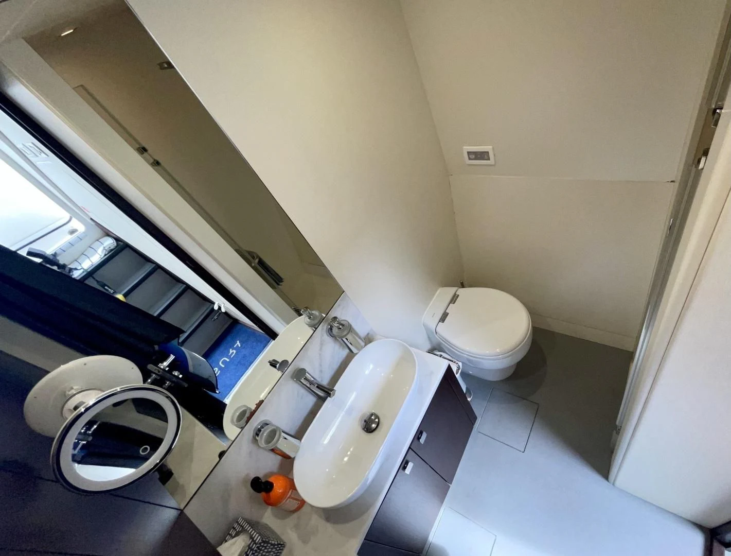 a bathroom with a large mirror aboard CAESURA Yacht for Sale