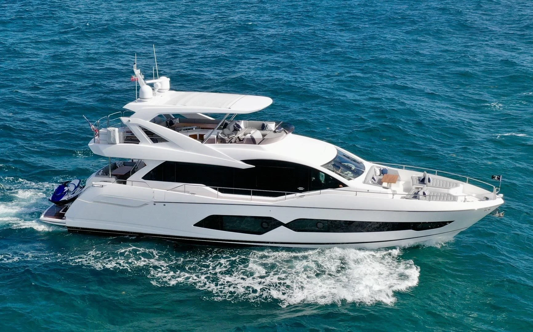 a white yacht on the water aboard CAESURA Yacht for Sale