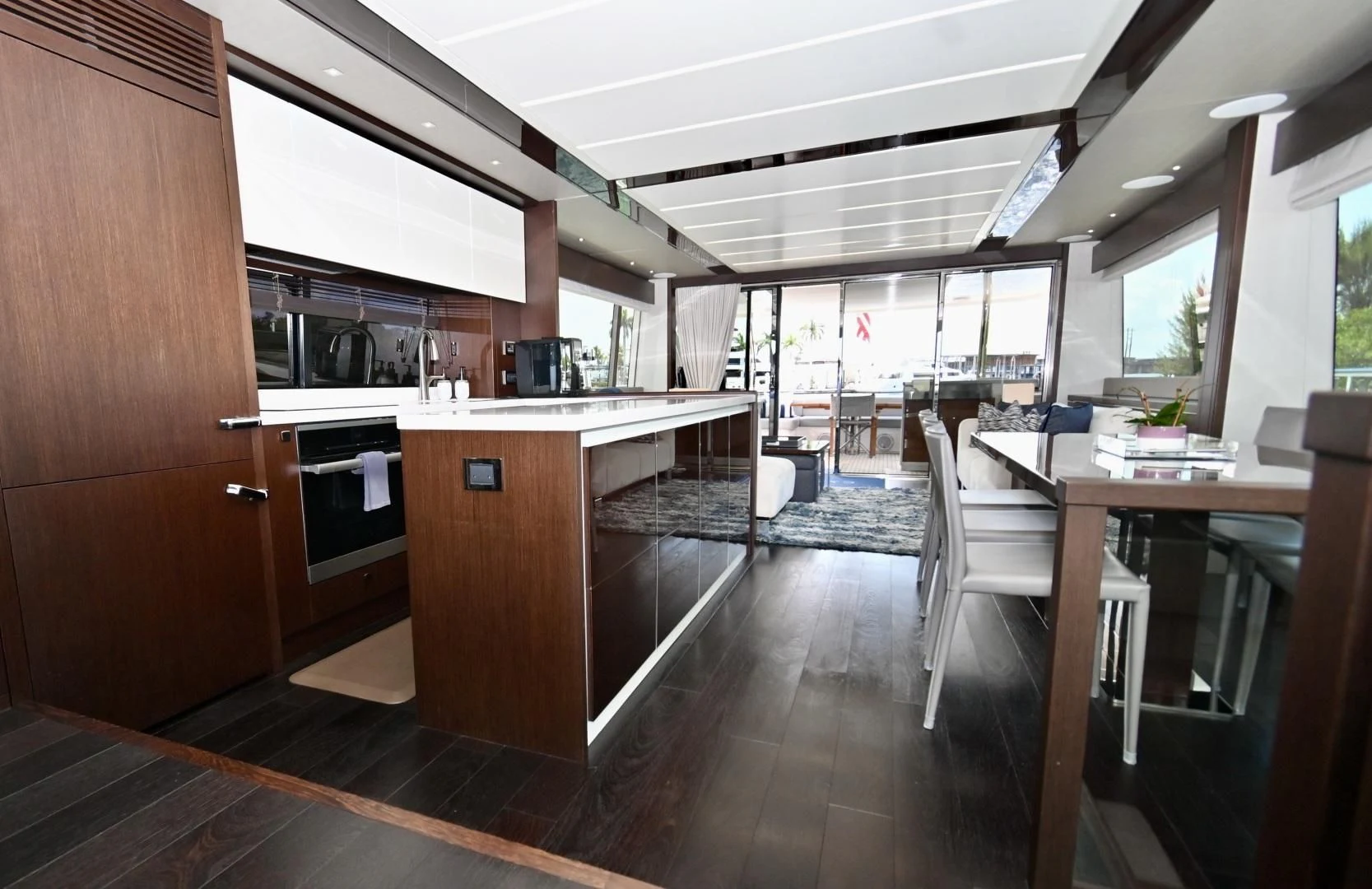 a kitchen with a wood floor aboard CAESURA Yacht for Sale