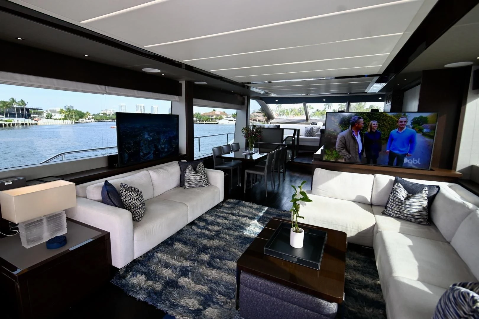 a living room with a large window aboard CAESURA Yacht for Sale