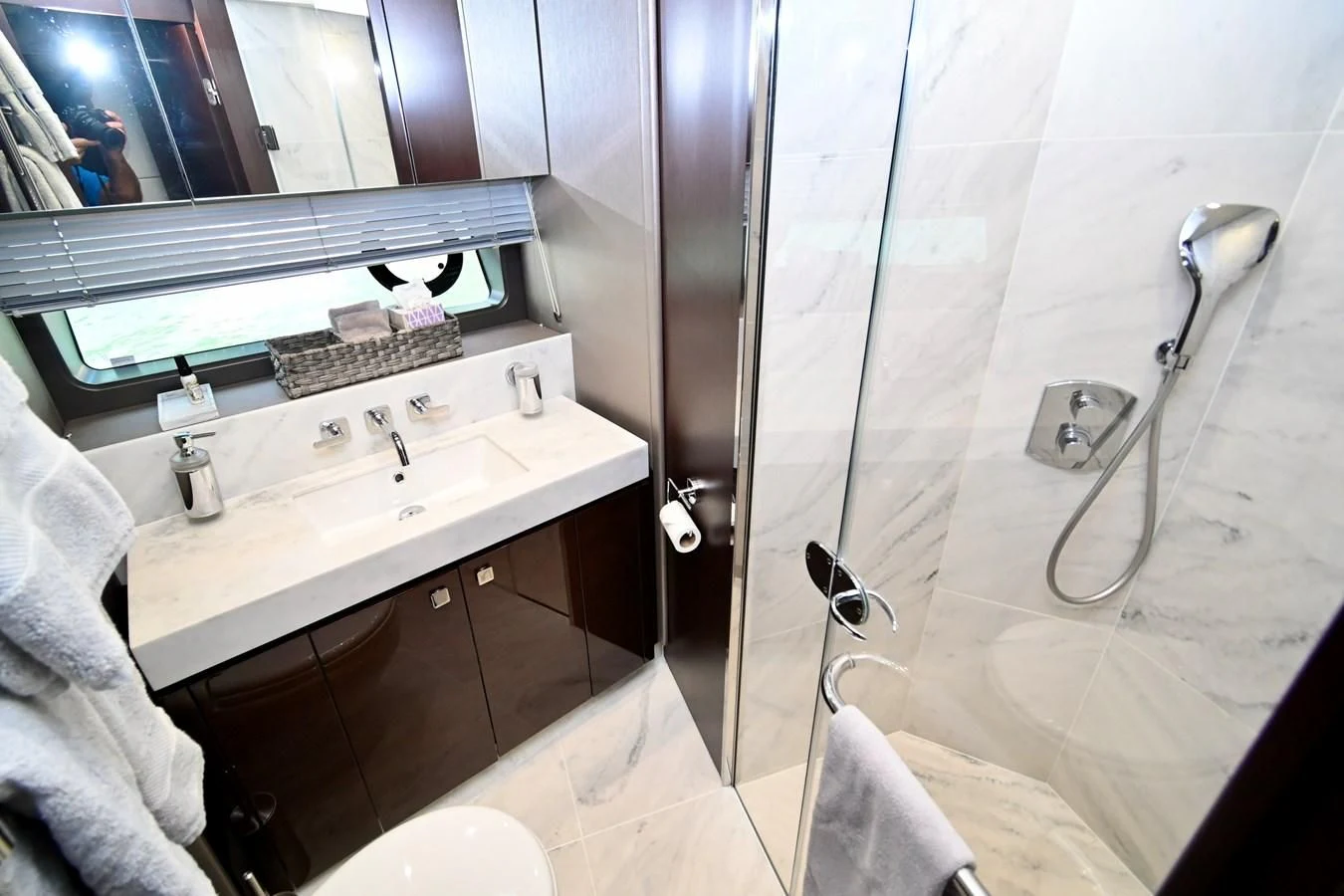 a bathroom with a shower and sink aboard CAESURA Yacht for Sale
