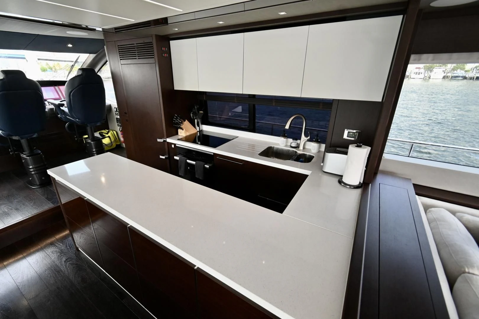 a kitchen with a large window aboard CAESURA Yacht for Sale
