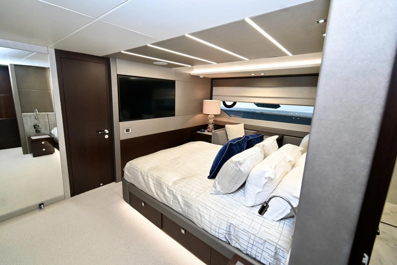 a room with a bed and a television aboard CAESURA Yacht for Sale