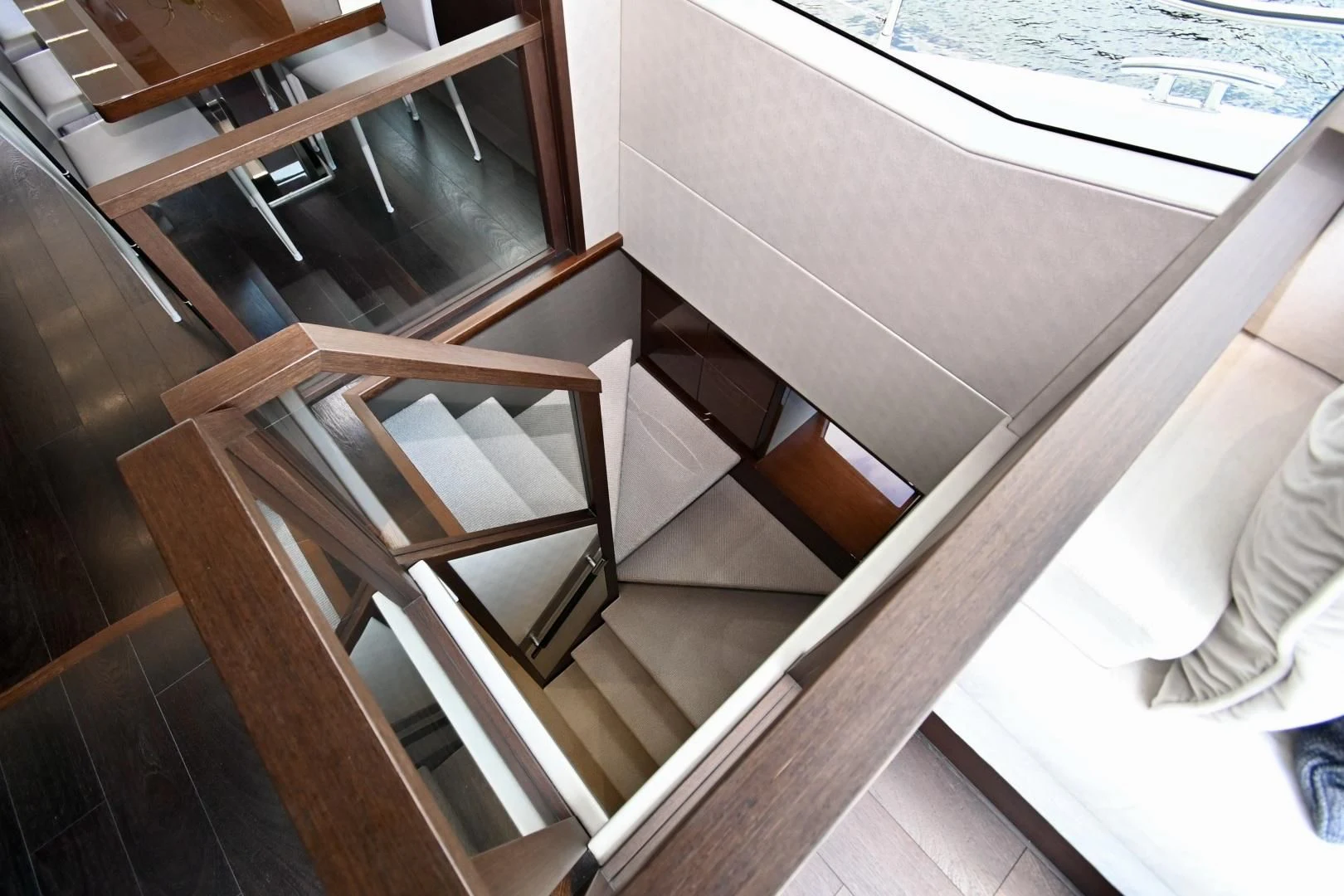 a wooden staircase with a railing aboard CAESURA Yacht for Sale