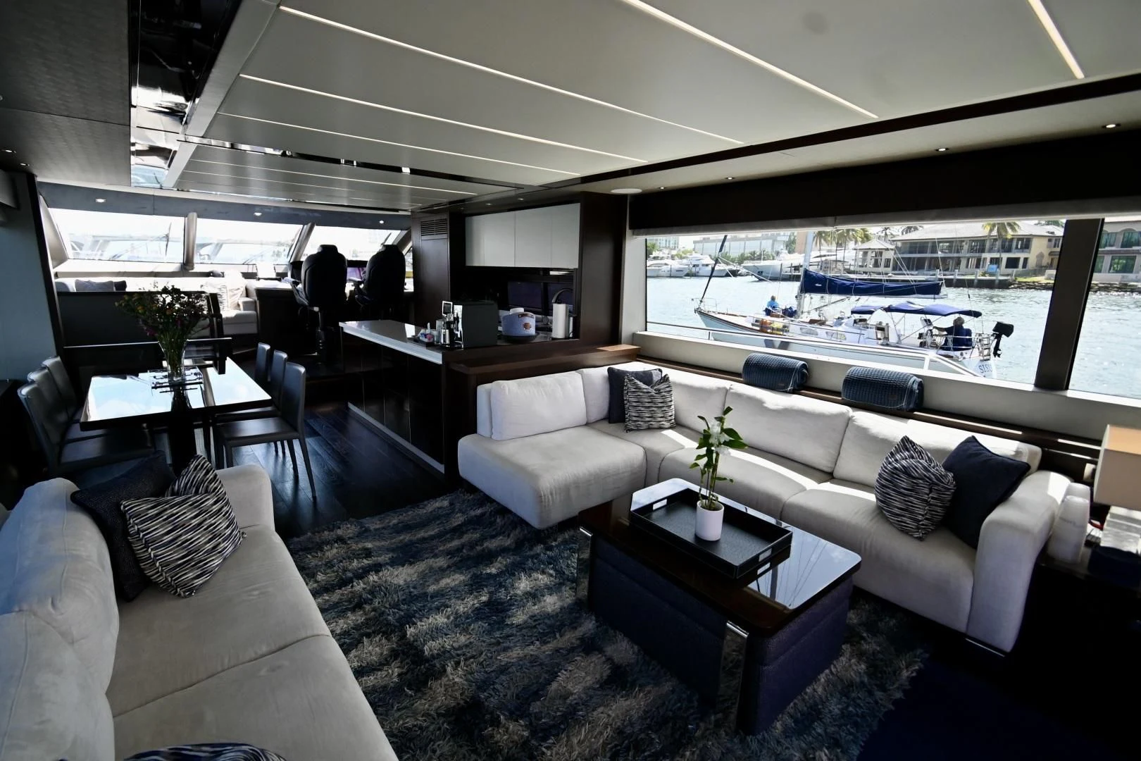 a living room with a large window aboard CAESURA Yacht for Sale