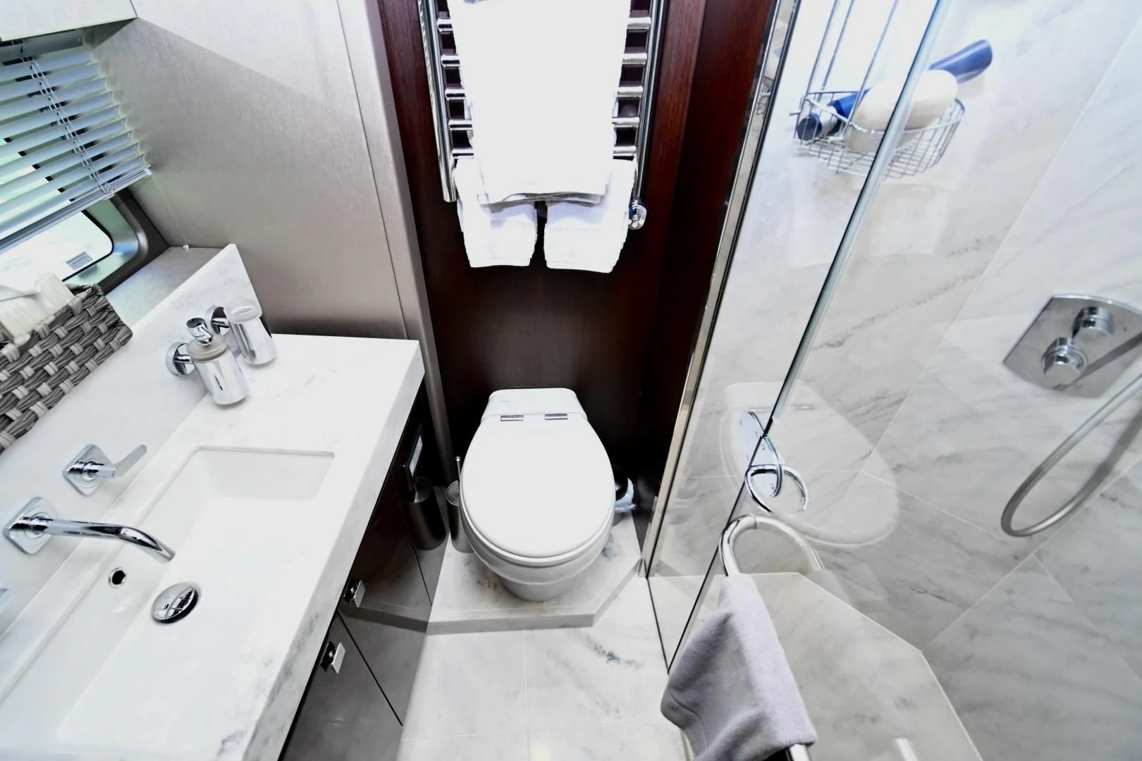 a bathroom with a toilet and sink aboard CAESURA Yacht for Sale