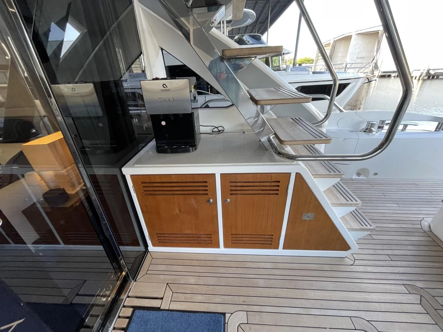 a room with a staircase and a computer on the ceiling aboard CAESURA Yacht for Sale