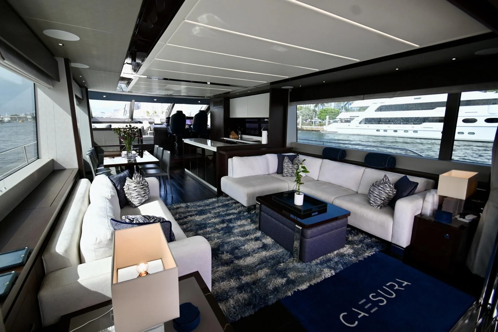 a living room with a large window aboard CAESURA Yacht for Sale
