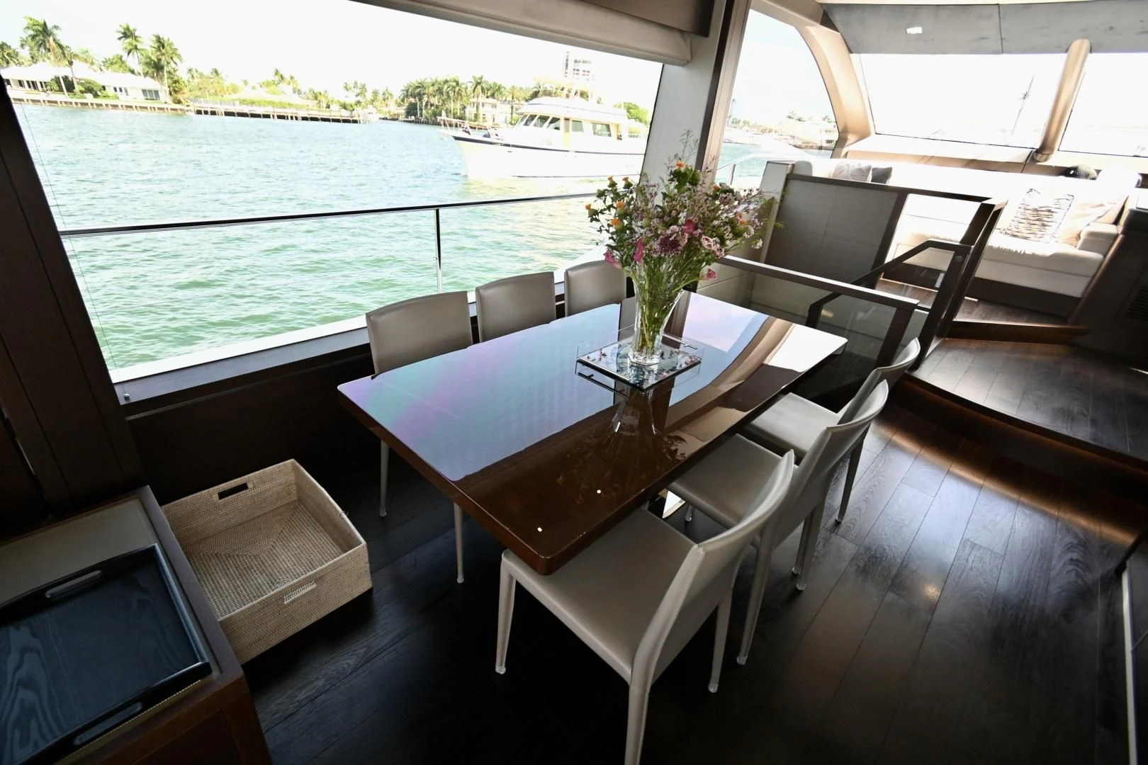 a table with chairs on it next to a body of water aboard CAESURA Yacht for Sale