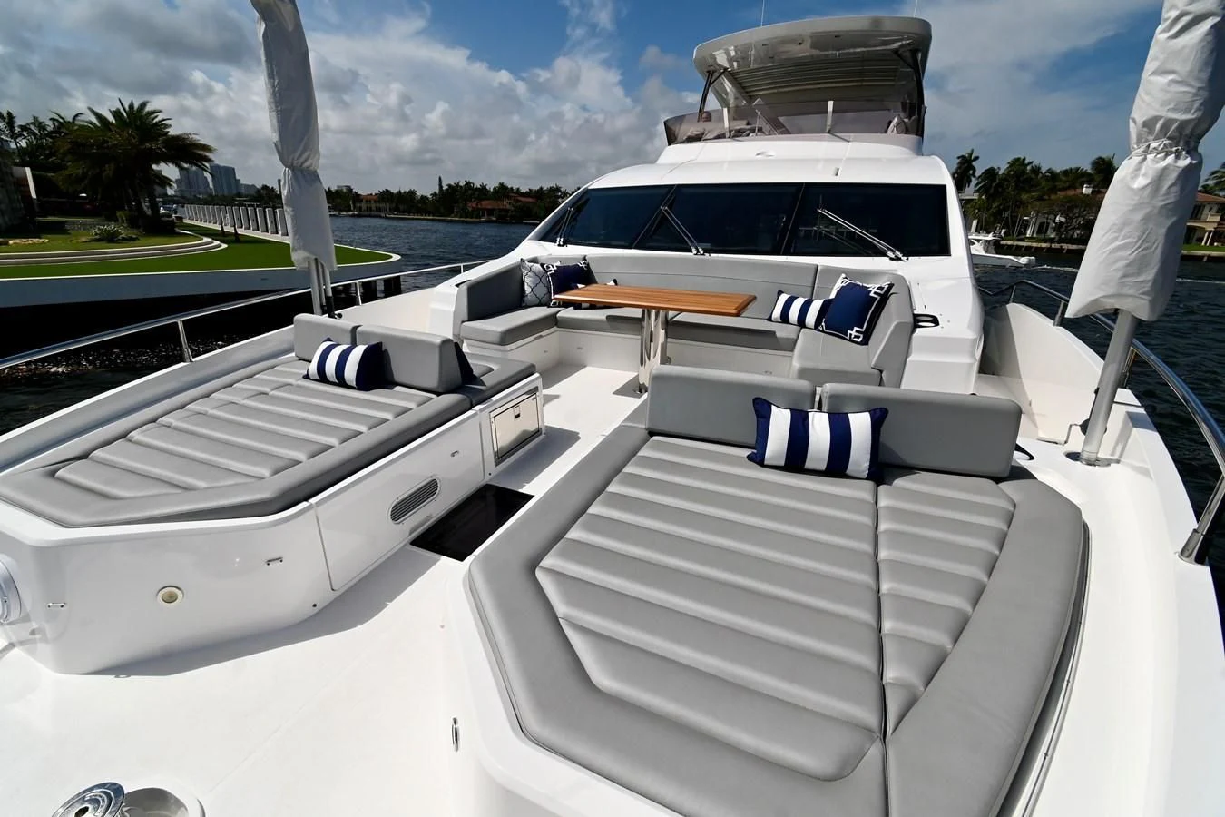 a white car with a surfboard on the back of it aboard CAESURA Yacht for Sale