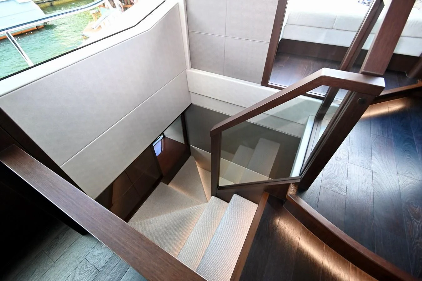a wooden staircase with a railing aboard CAESURA Yacht for Sale