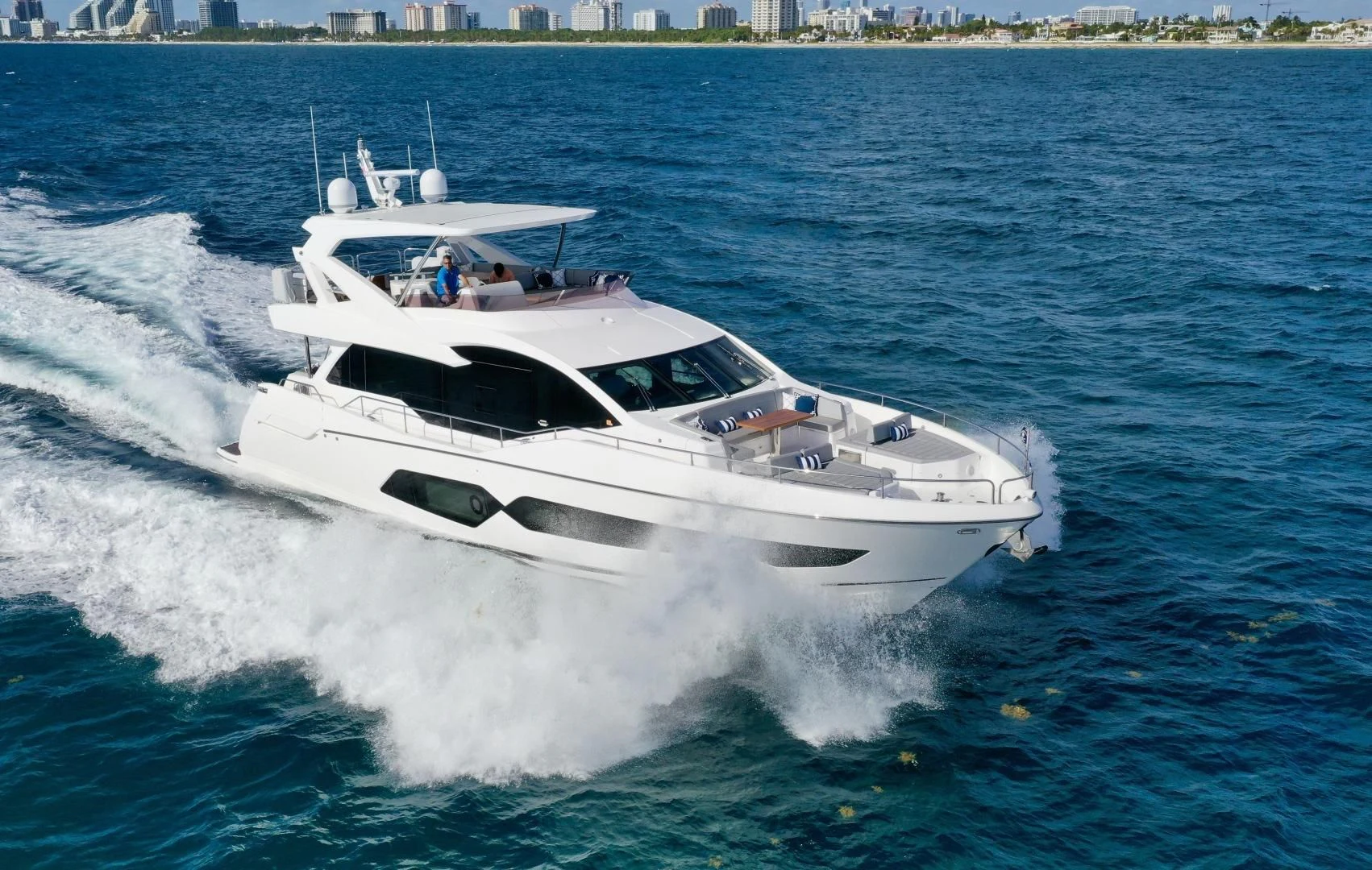 a white yacht on the water aboard CAESURA Yacht for Sale