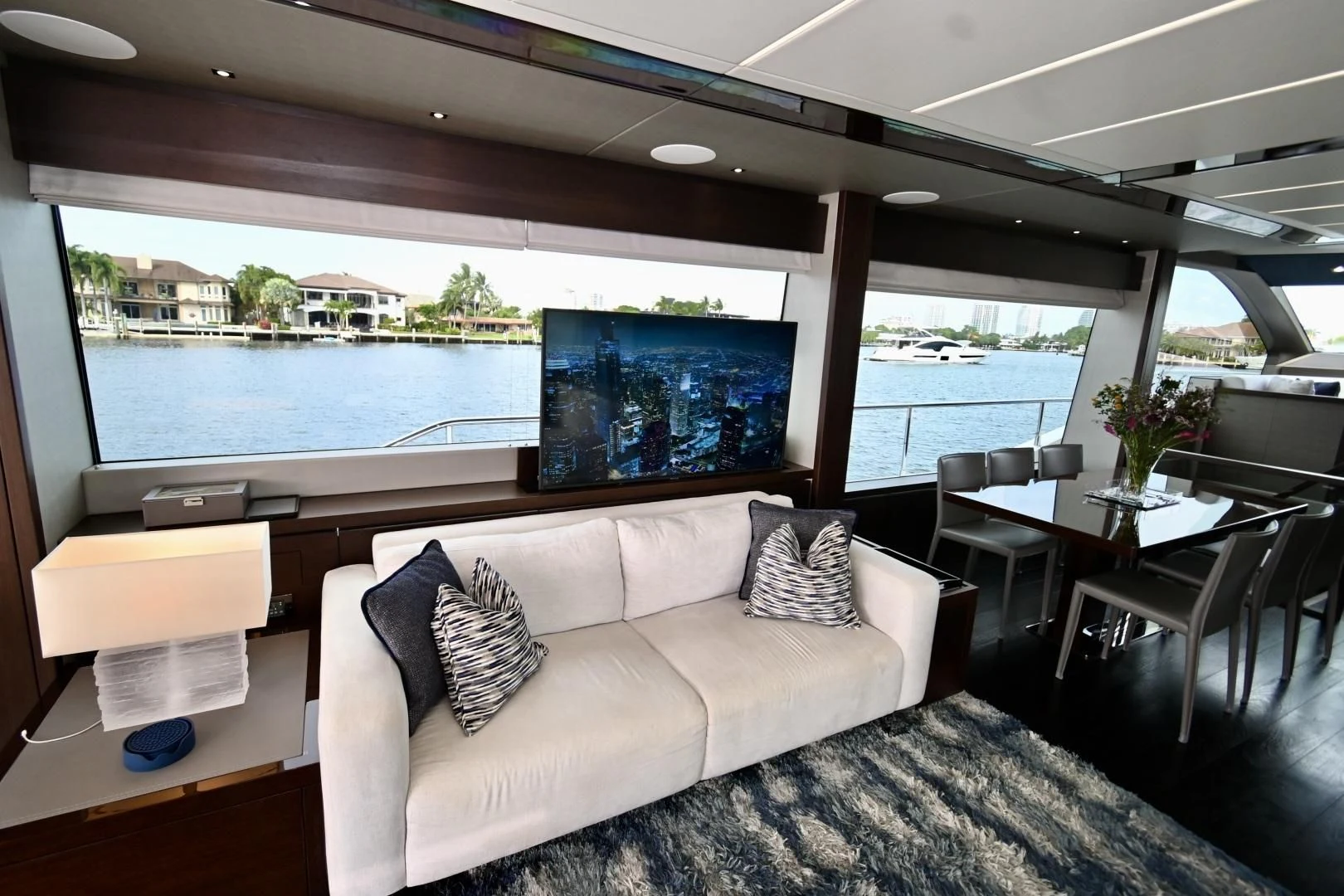 a living room with a large window aboard CAESURA Yacht for Sale