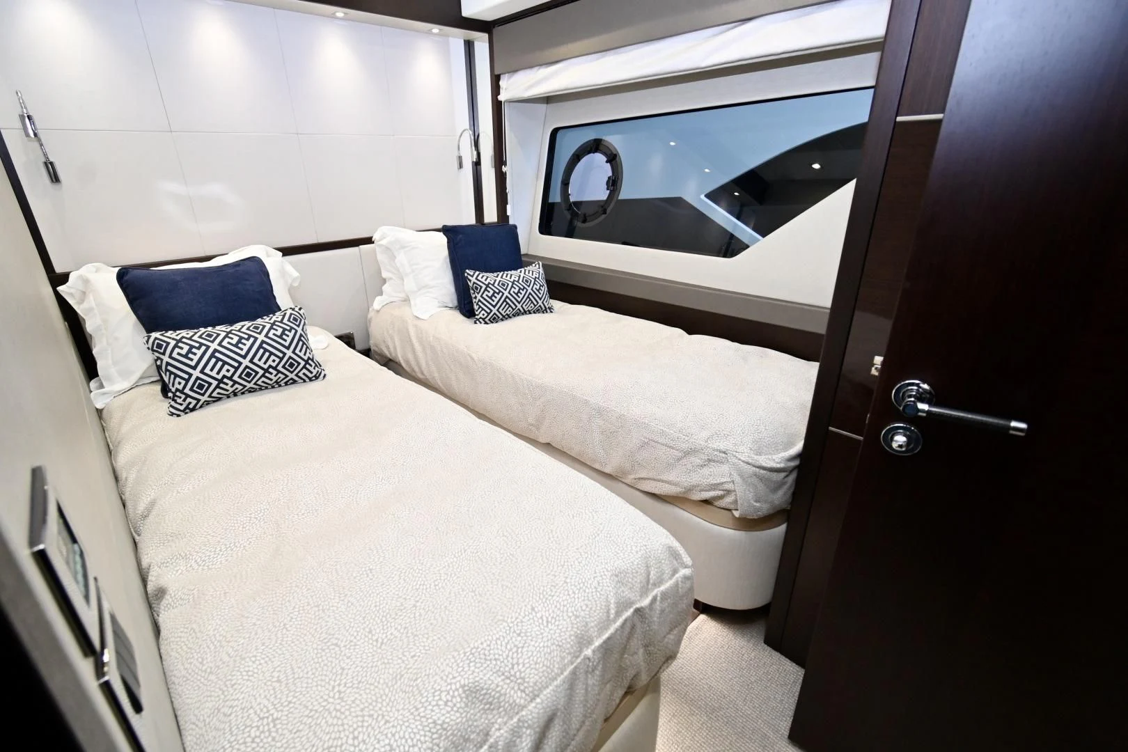 a room with two beds aboard CAESURA Yacht for Sale