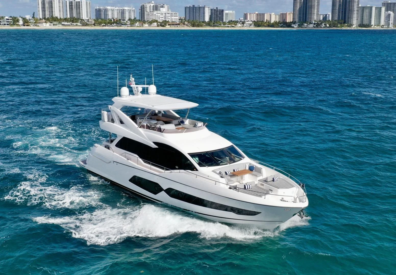 a white yacht on the water aboard CAESURA Yacht for Sale