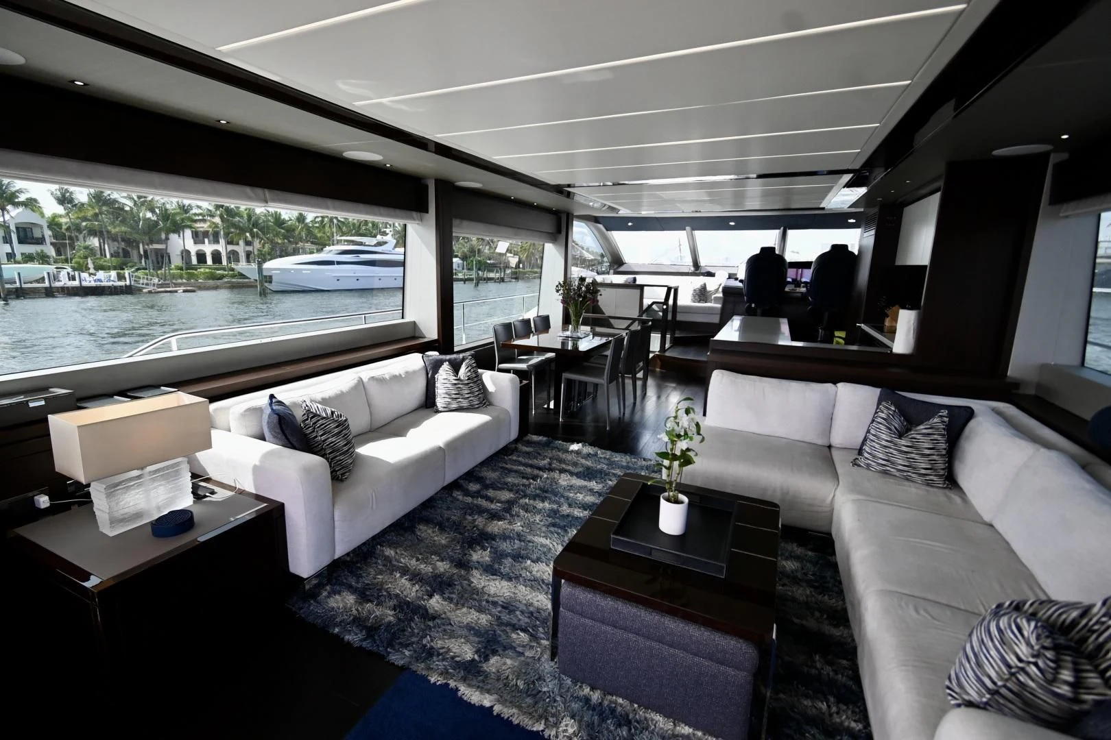 a living room with a large window aboard CAESURA Yacht for Sale