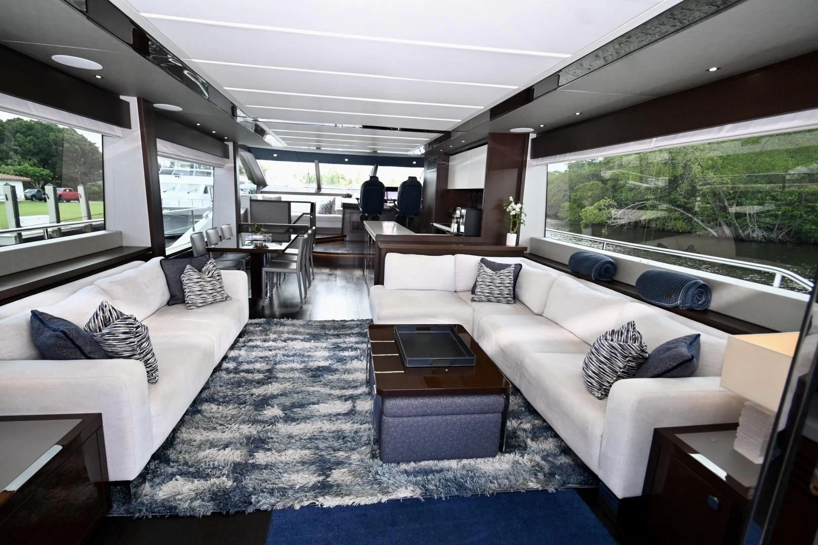a living room with a couch and a table aboard CAESURA Yacht for Sale