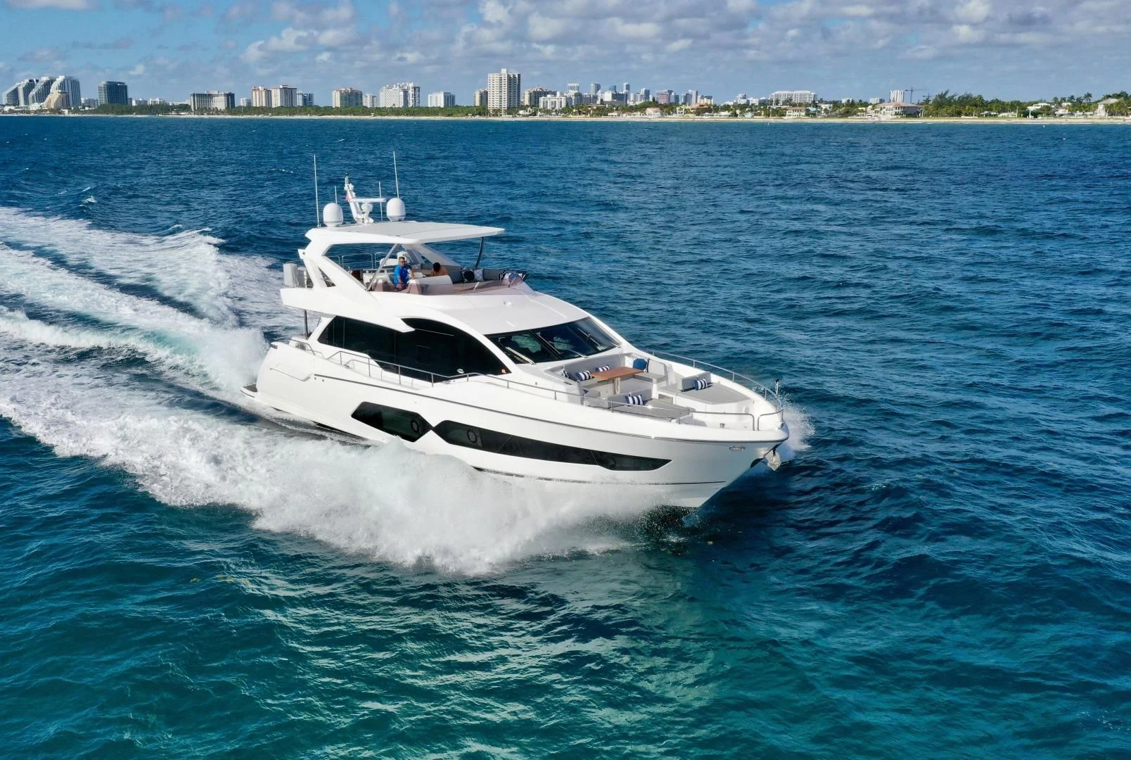 a white yacht on the water aboard CAESURA Yacht for Sale