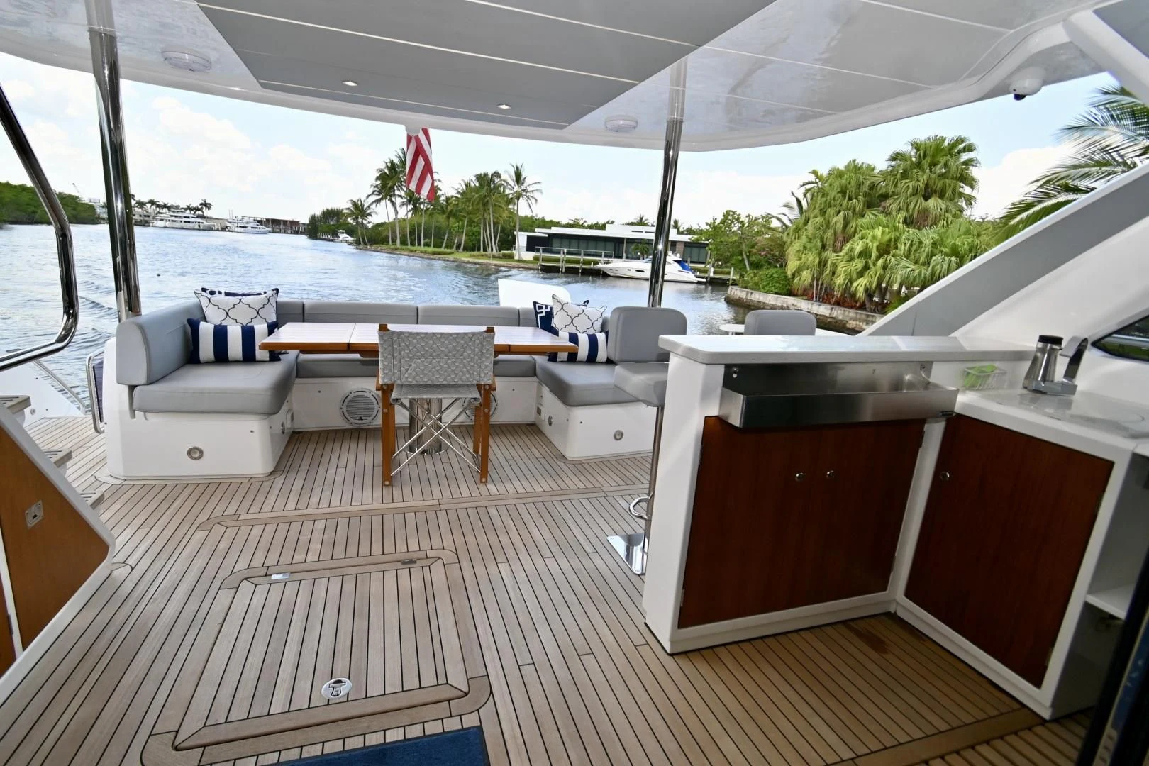 a deck with a view of the water and a dock aboard CAESURA Yacht for Sale