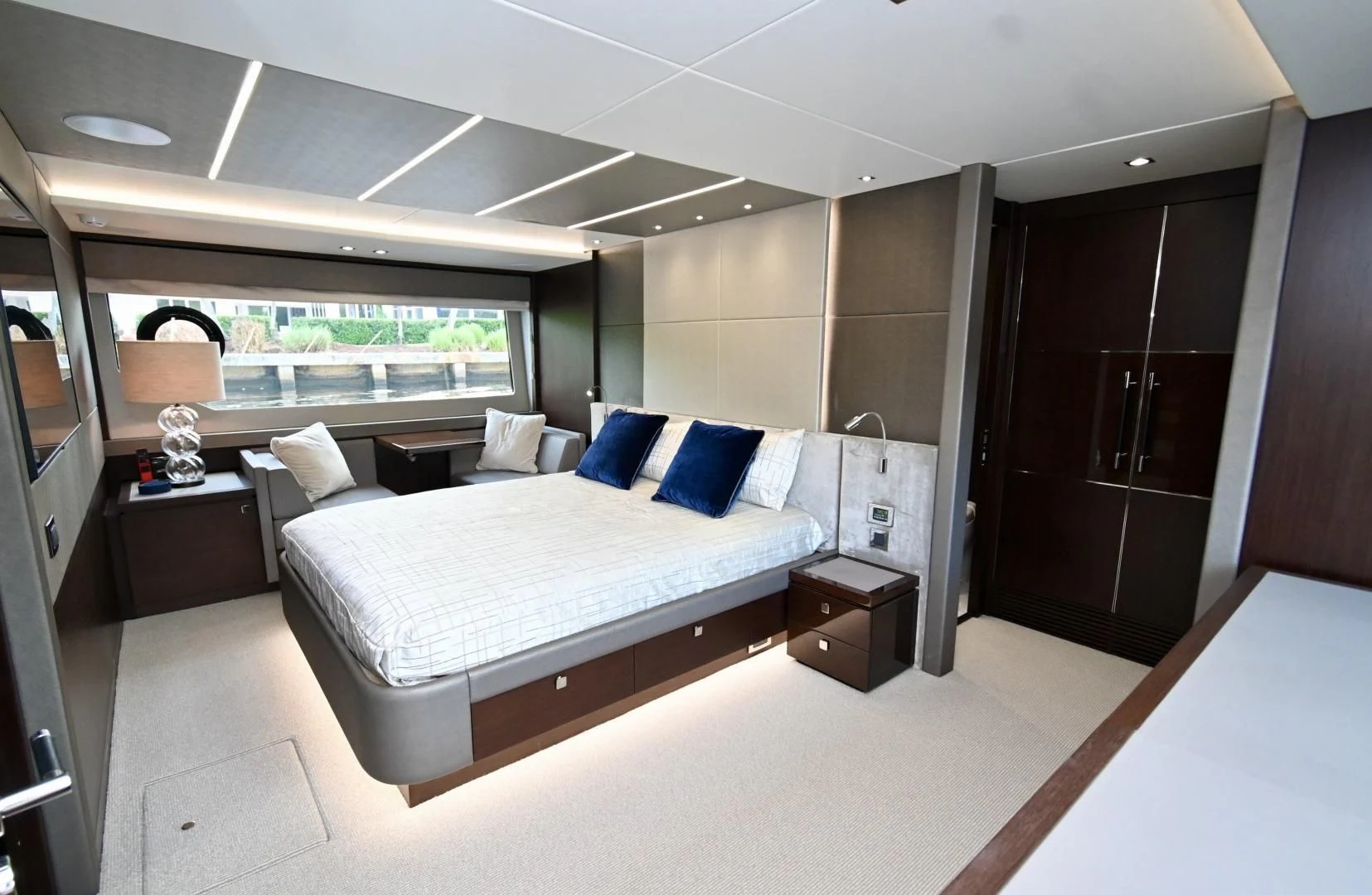 a room with a bed and a desk aboard CAESURA Yacht for Sale
