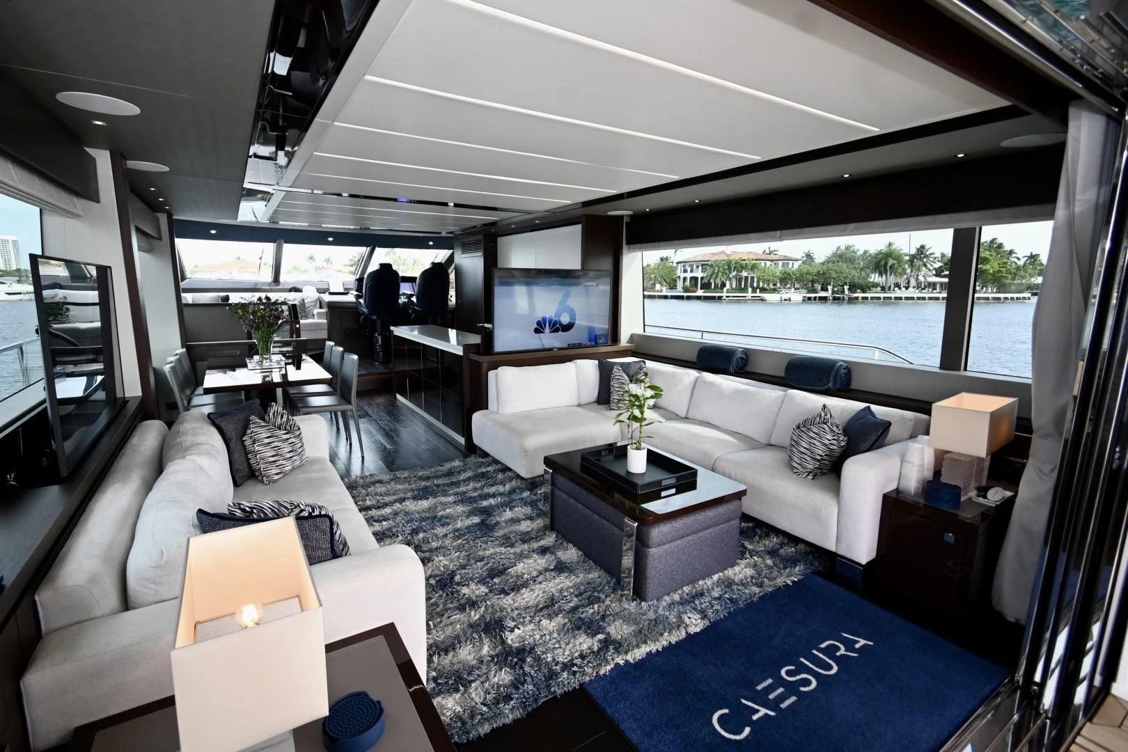 a living room with a large window aboard CAESURA Yacht for Sale