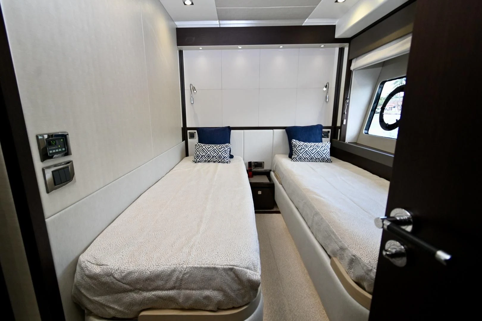 a room with a bed and a window aboard CAESURA Yacht for Sale