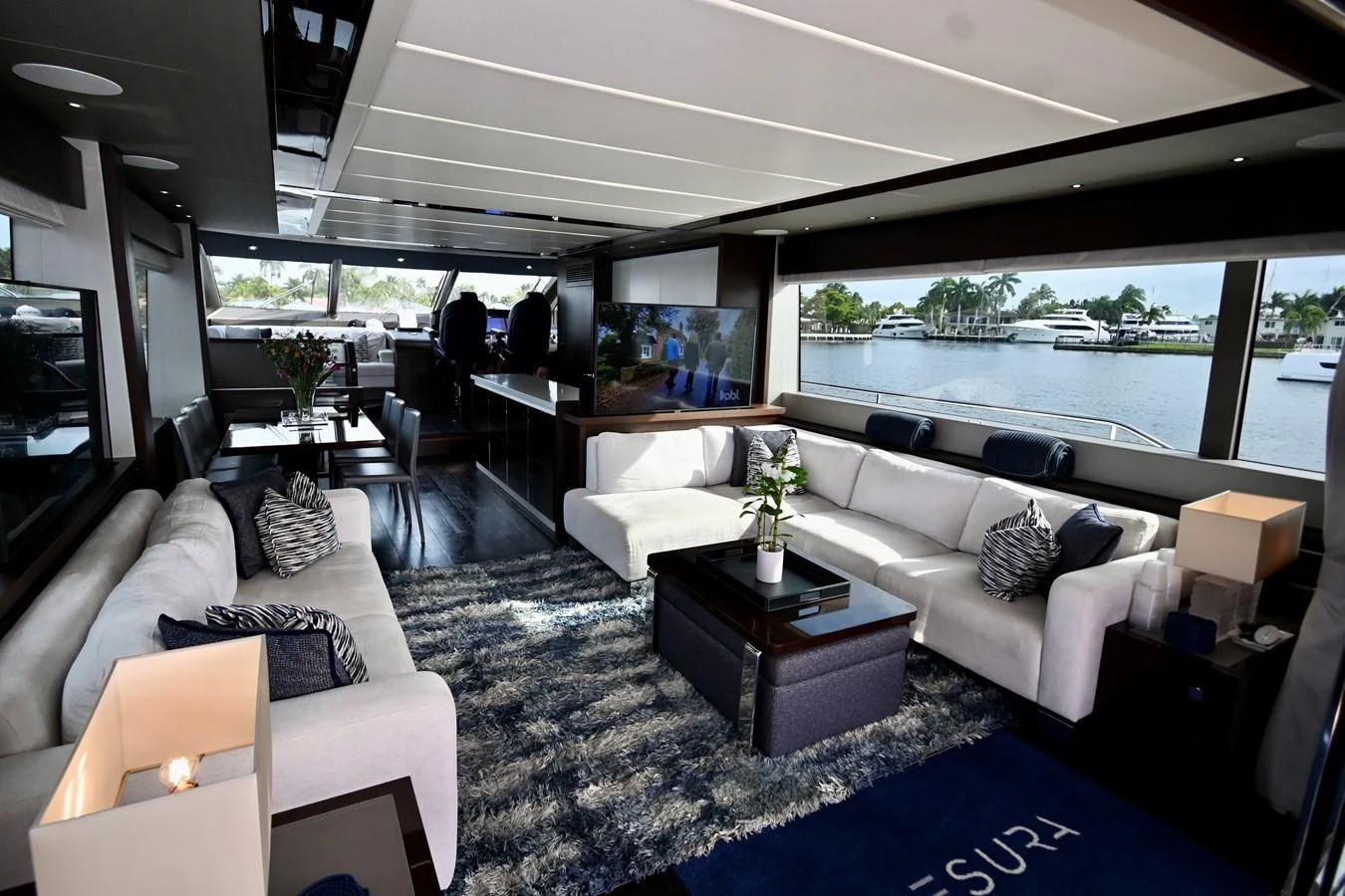 a living room with a large window aboard CAESURA Yacht for Sale