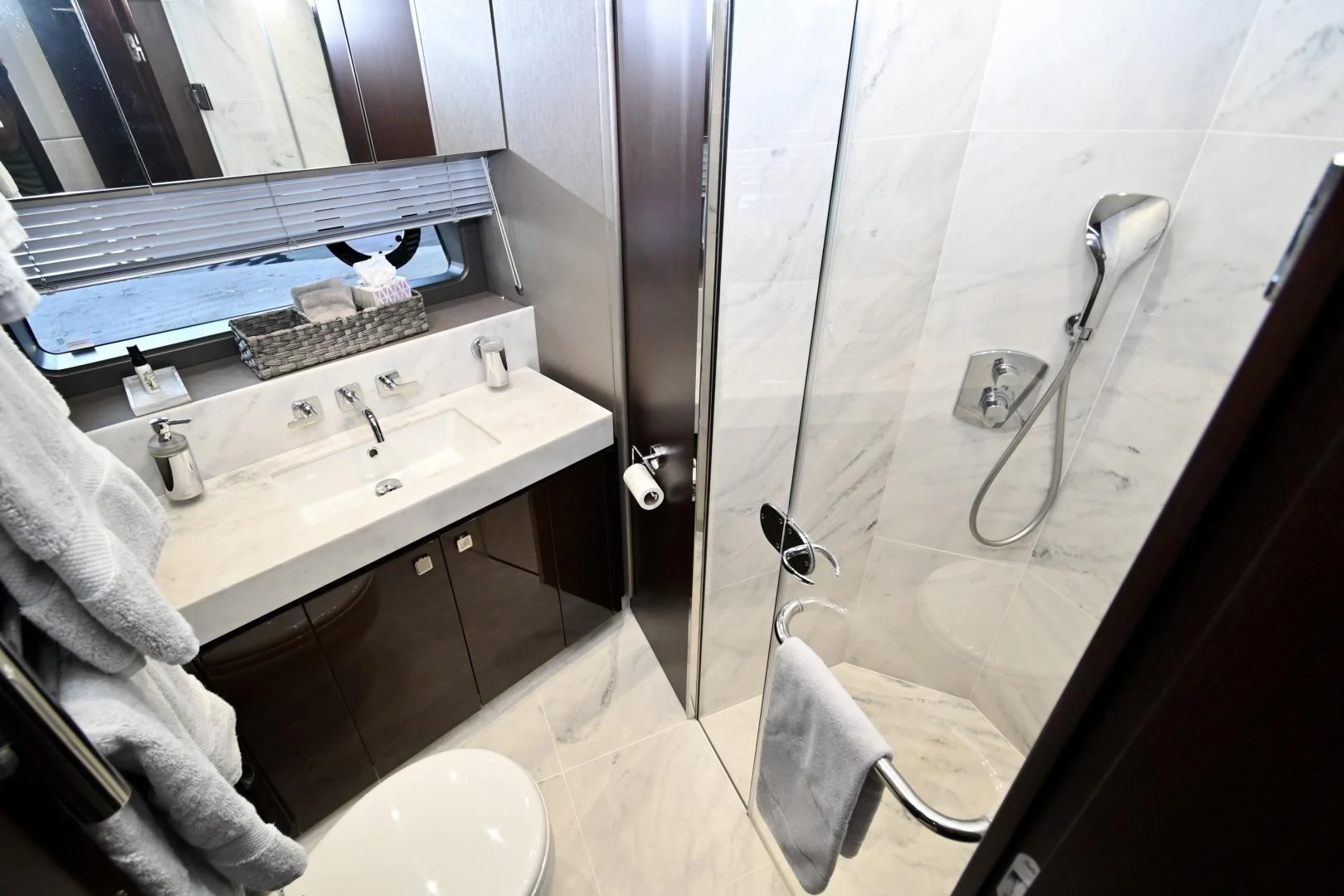 a bathroom with a shower and sink aboard CAESURA Yacht for Sale