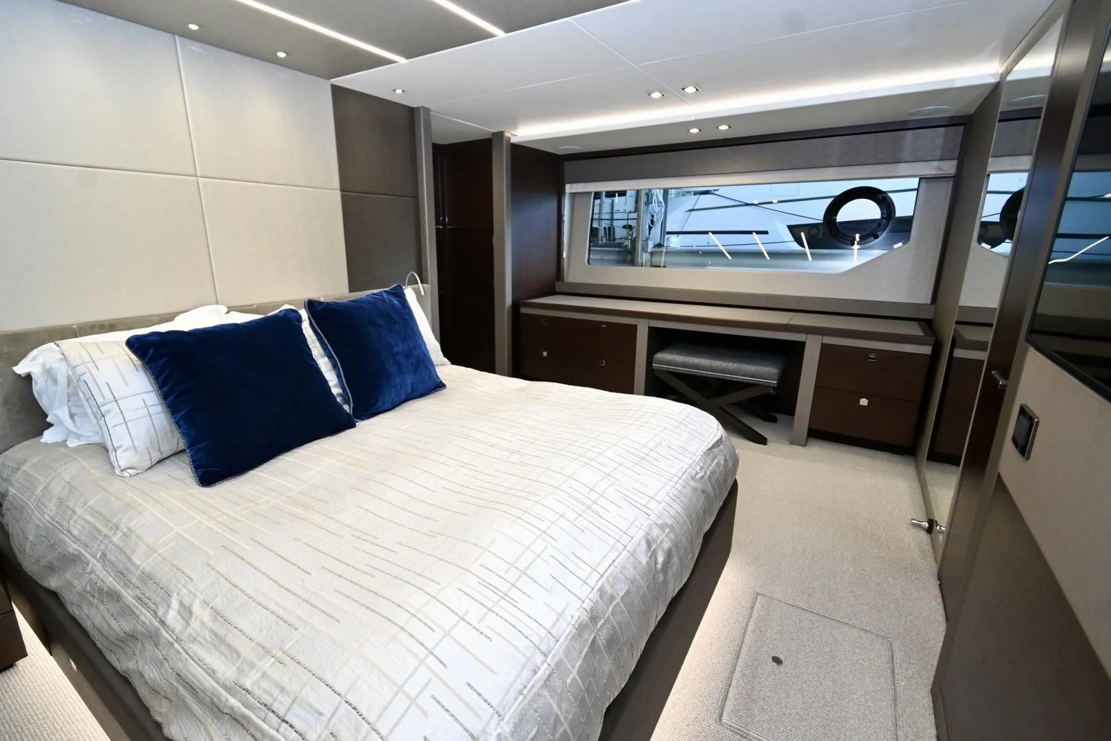 a bedroom with a large bed aboard CAESURA Yacht for Sale