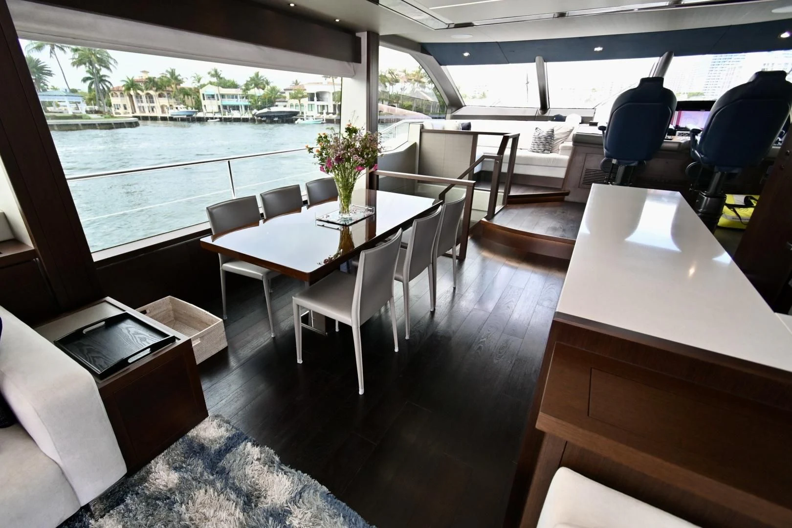 a room with tables and chairs aboard CAESURA Yacht for Sale