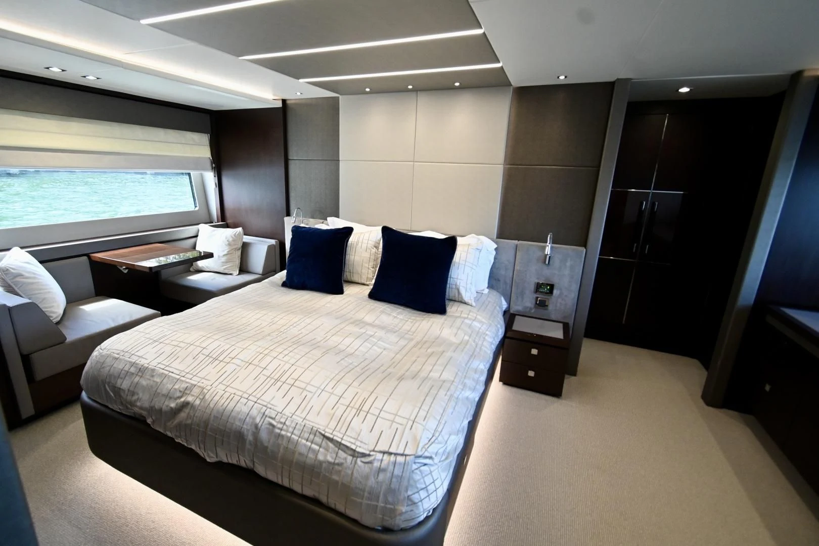 a room with a bed and a window aboard CAESURA Yacht for Sale