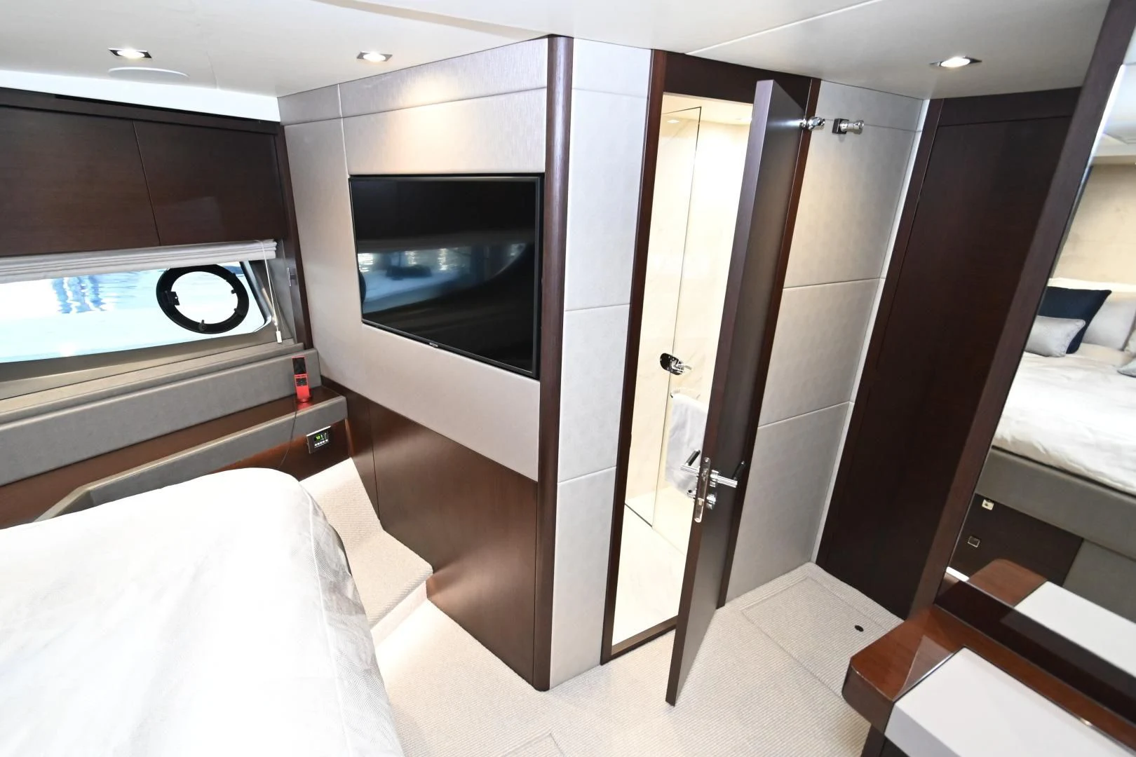 a room with a bed and a television aboard CAESURA Yacht for Sale