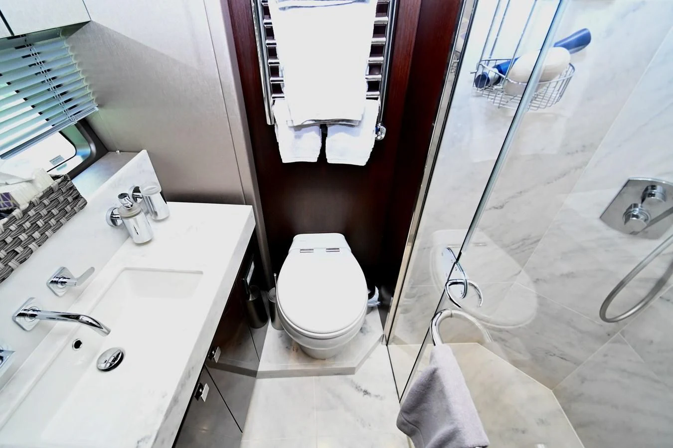 a bathroom with a toilet and sink aboard CAESURA Yacht for Sale