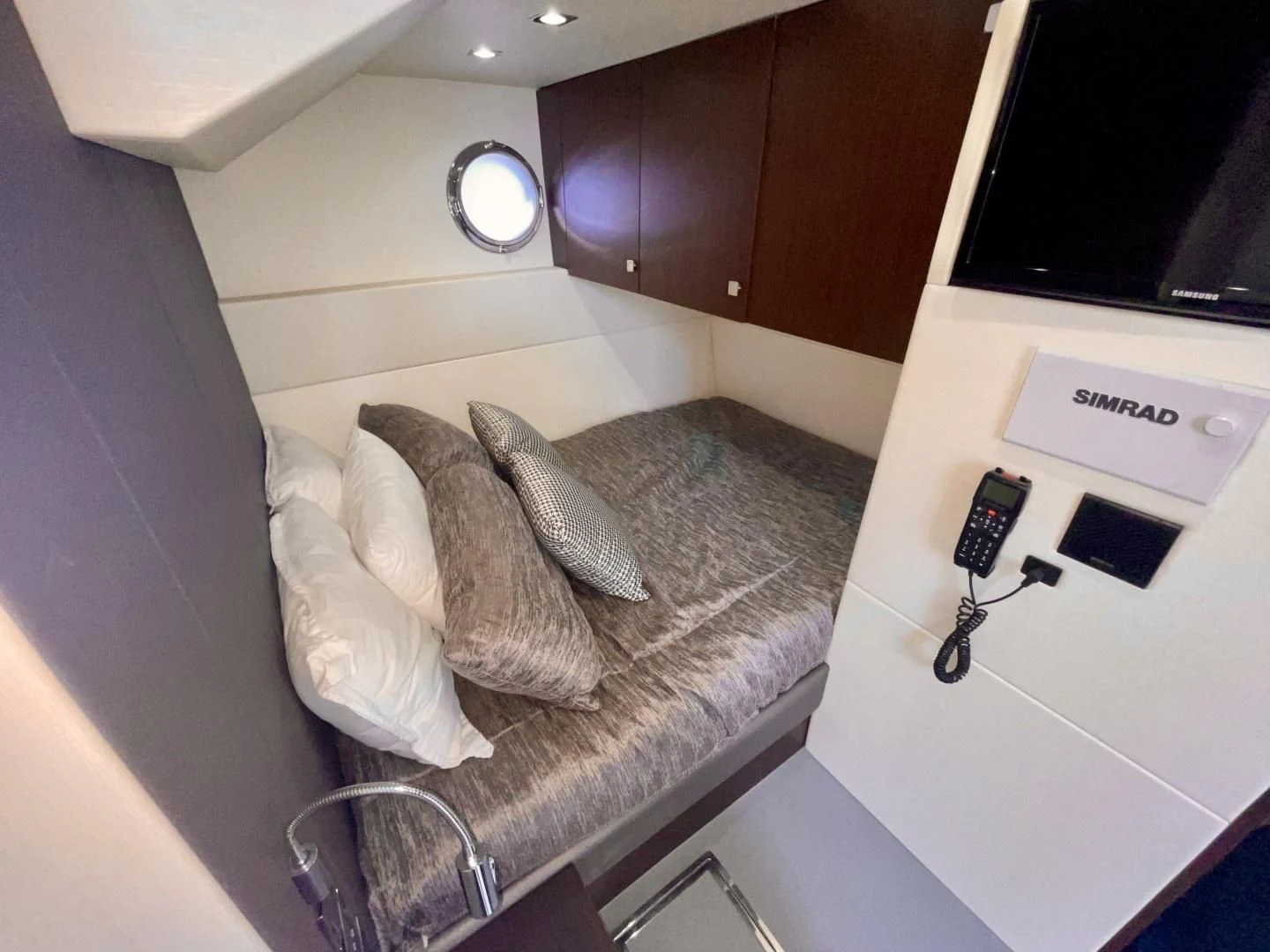 a room with a bed and a television aboard CAESURA Yacht for Sale