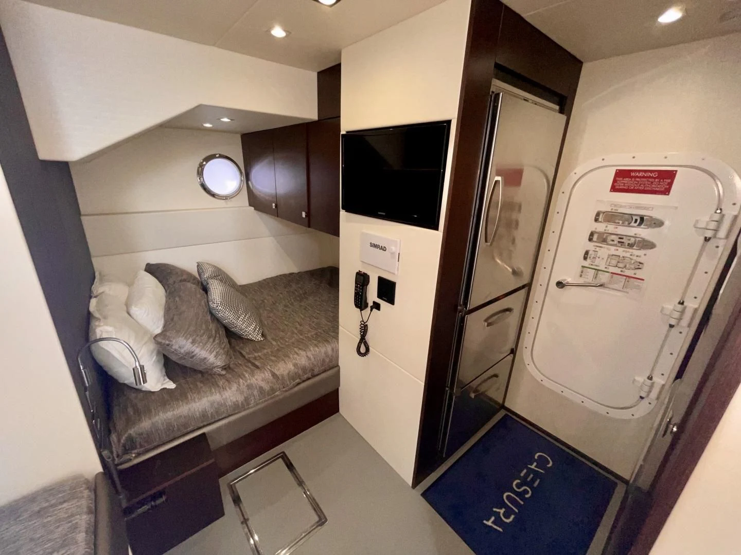 a room with a couch and a television aboard CAESURA Yacht for Sale