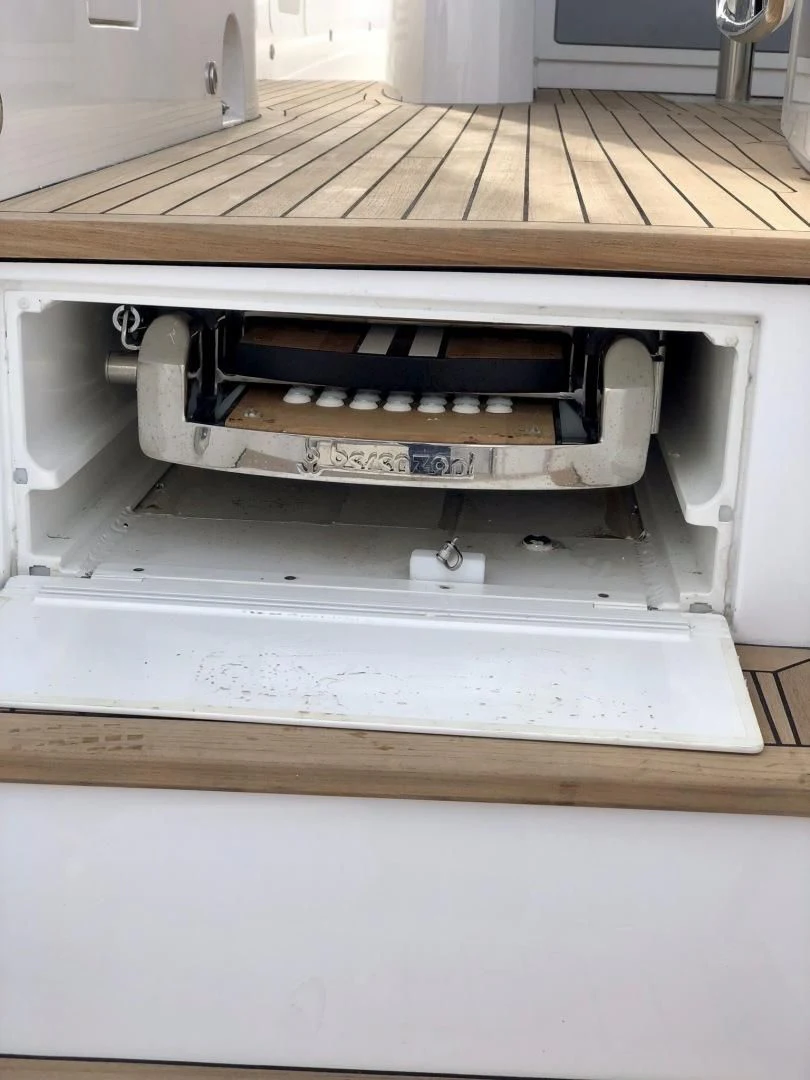 a white rectangular object with a wooden surface aboard CAESURA Yacht for Sale